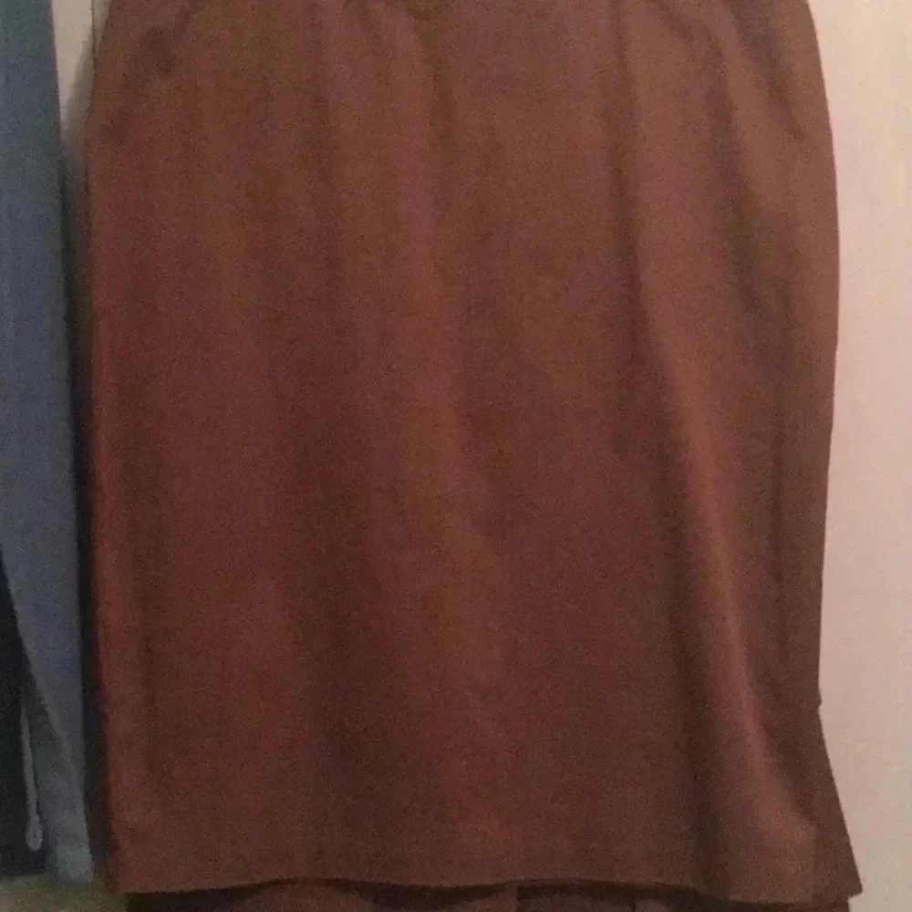 NYC sleeveless suit top and matching skirt